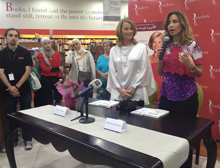 HRH Princess Ghida Talal speaks during a ceremony to promote a book by Lucy O’Donnell (left foreground) on the latter’s fight against cancer, in Amman on Tuesday (Photo by Suzanna Goussous)